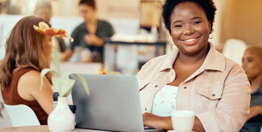 Smiling woman on her computer