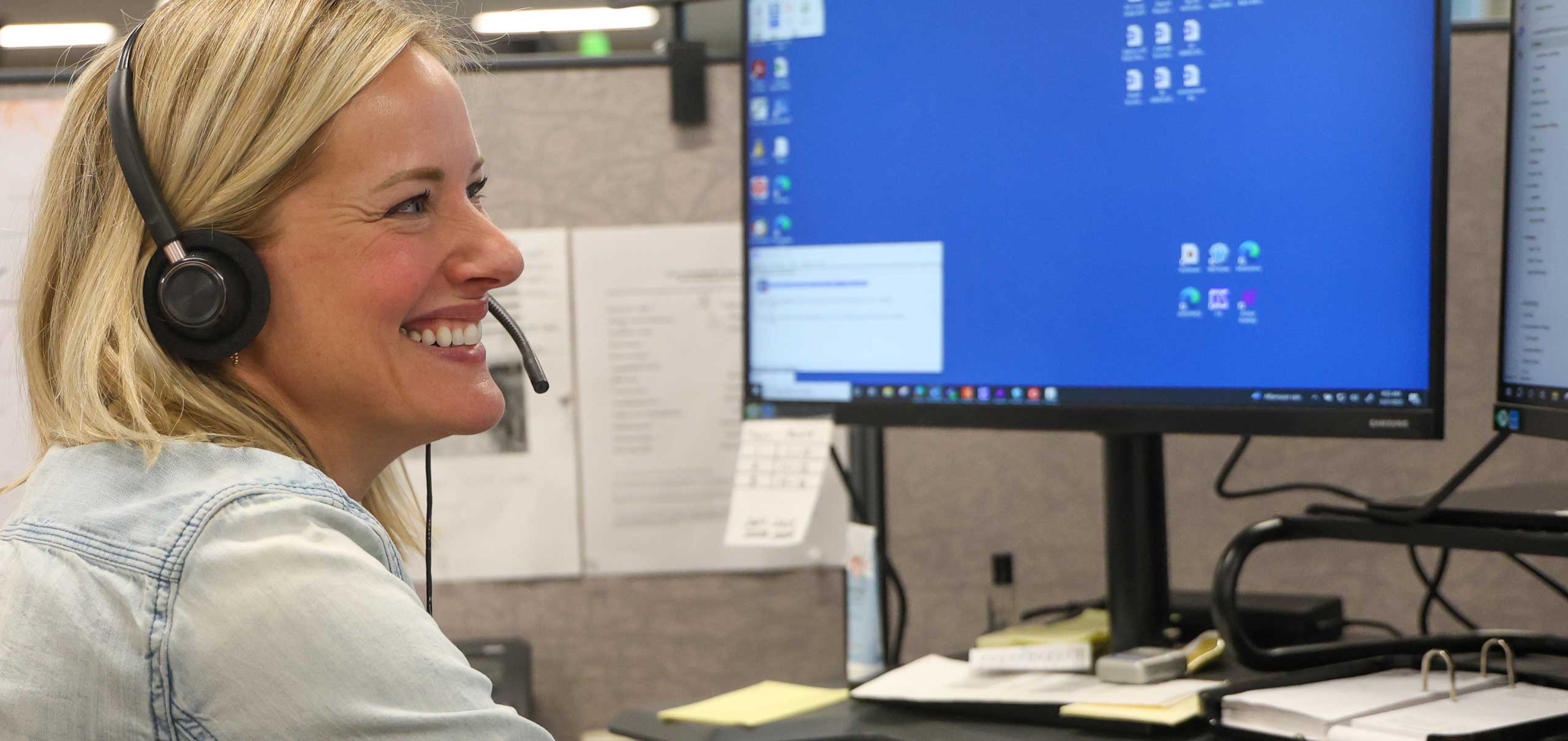 NIPSCO employee smiling while working