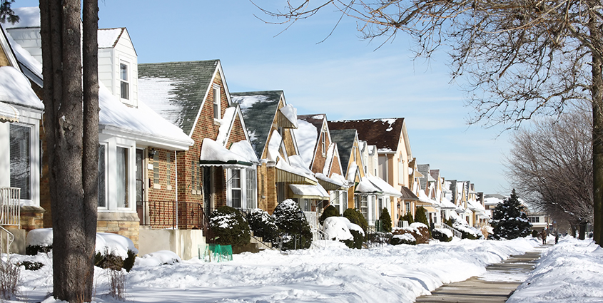 Row of brick houses cover in snow